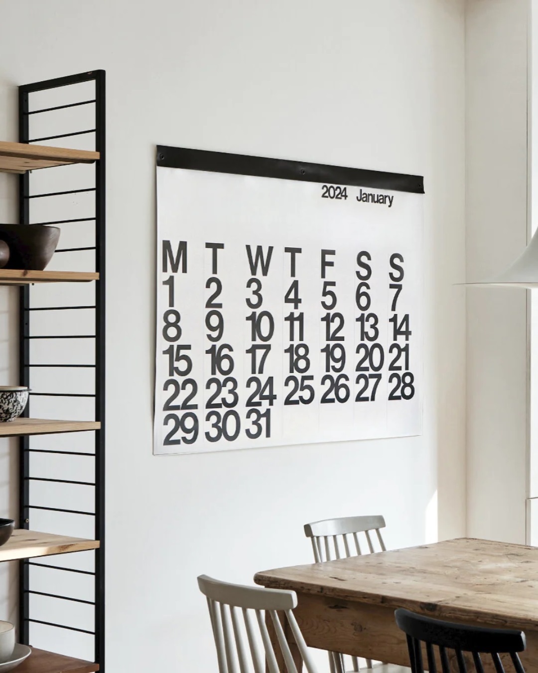 White stendig calendar on dining room wall