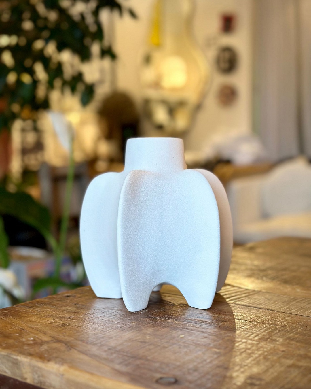 White vase on wooden table