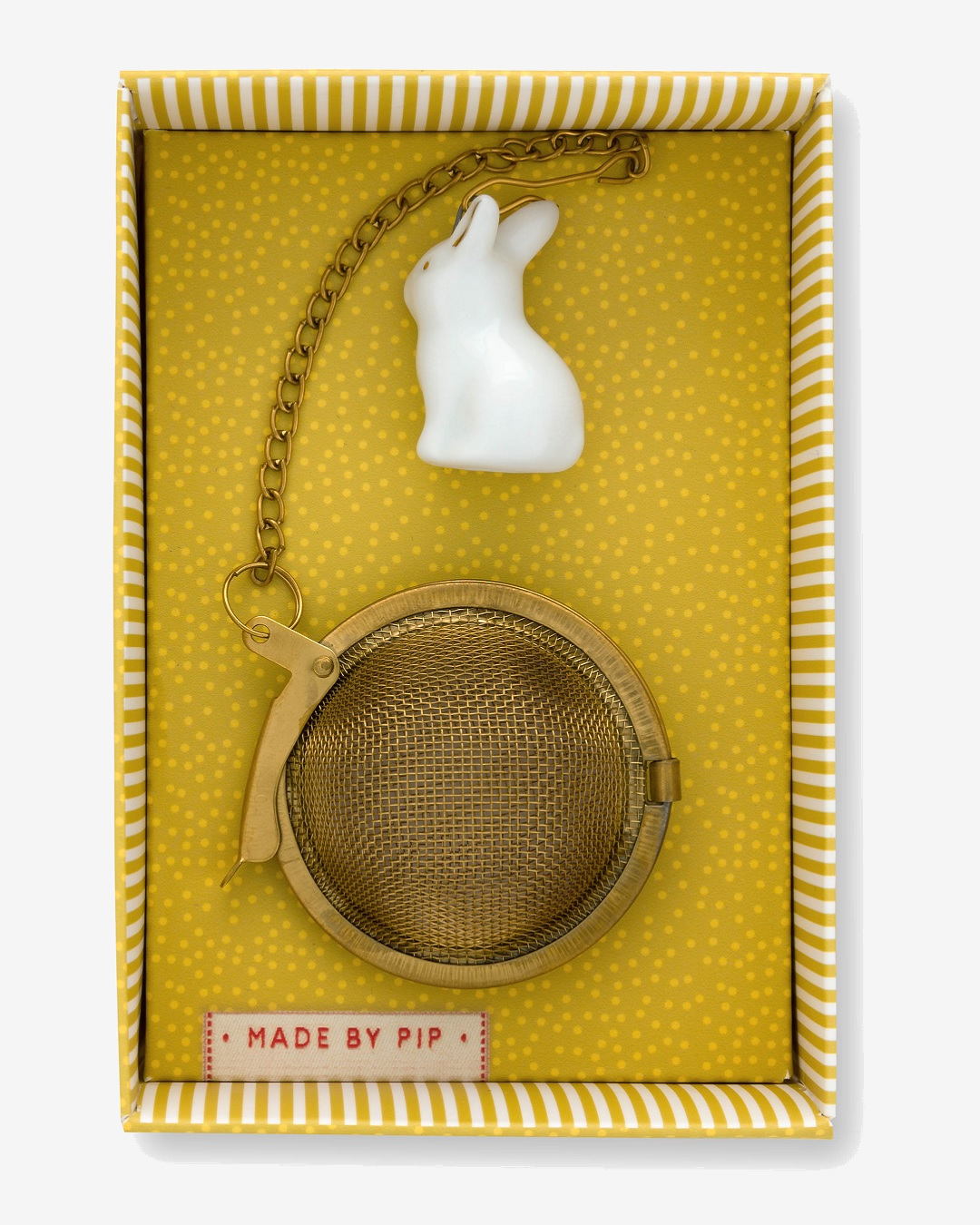 White Rabbit tea infuser with gold tea basket in yellow box