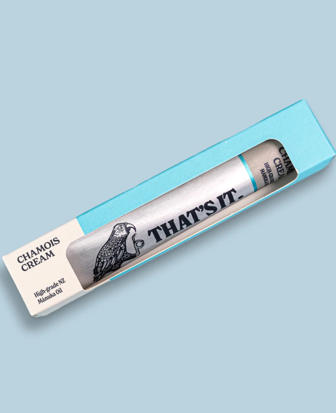 That's it chamois cream in silver aluminium tube in box on blue background
