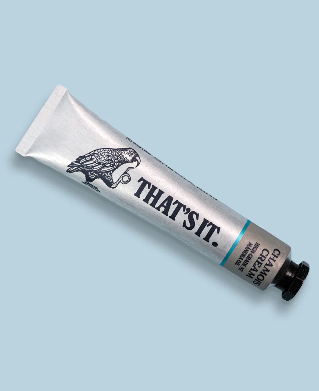 That's it chamois cream in silver aluminium tube on blue background