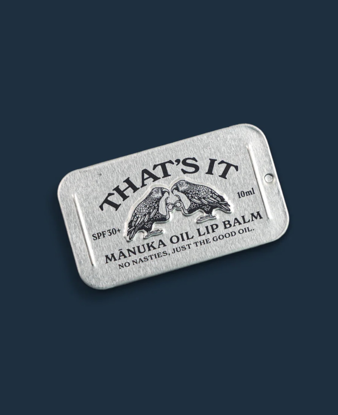 That's it lip balm in silver aluminium tin on navy background