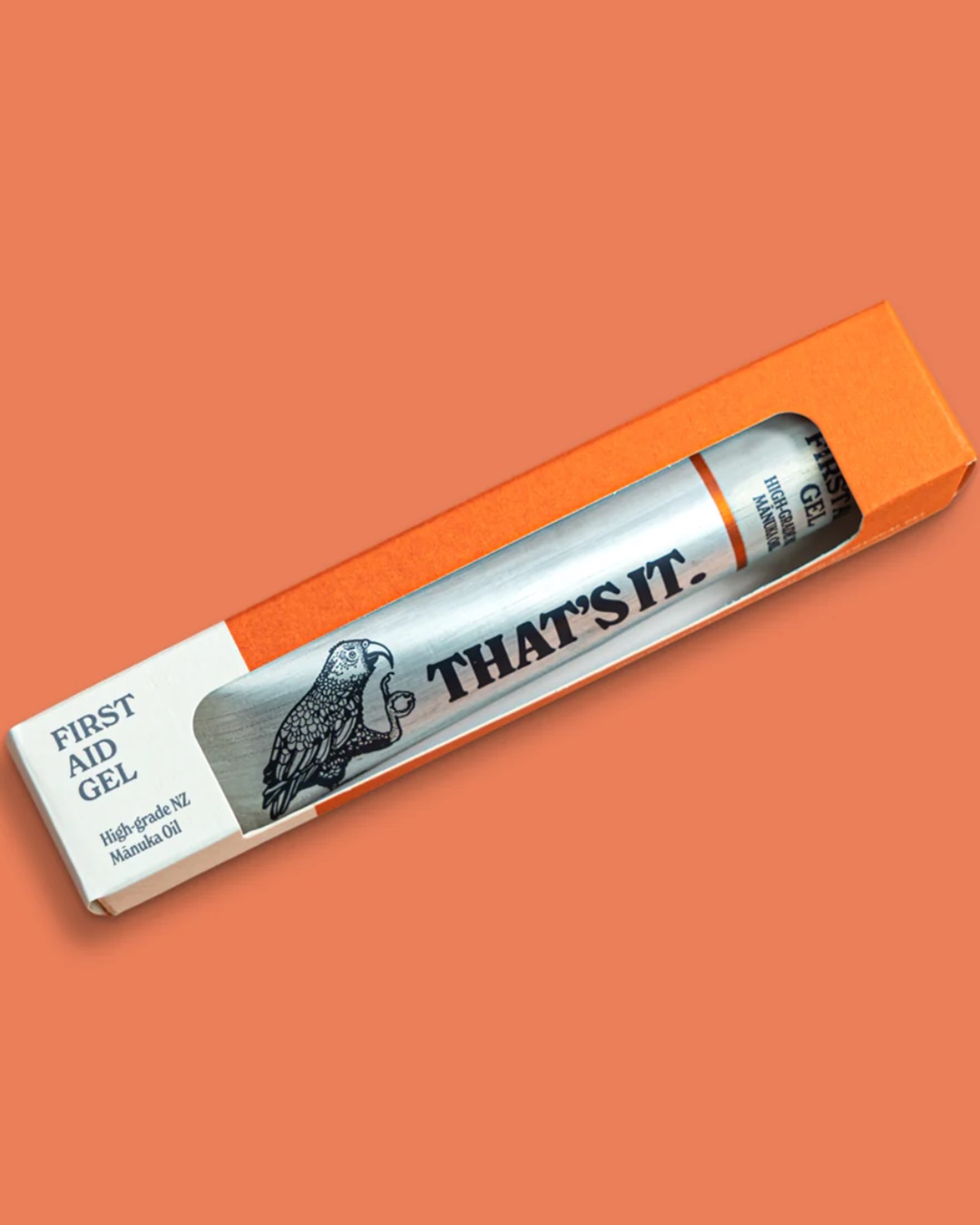 First aid gel silver tube in box on orange background