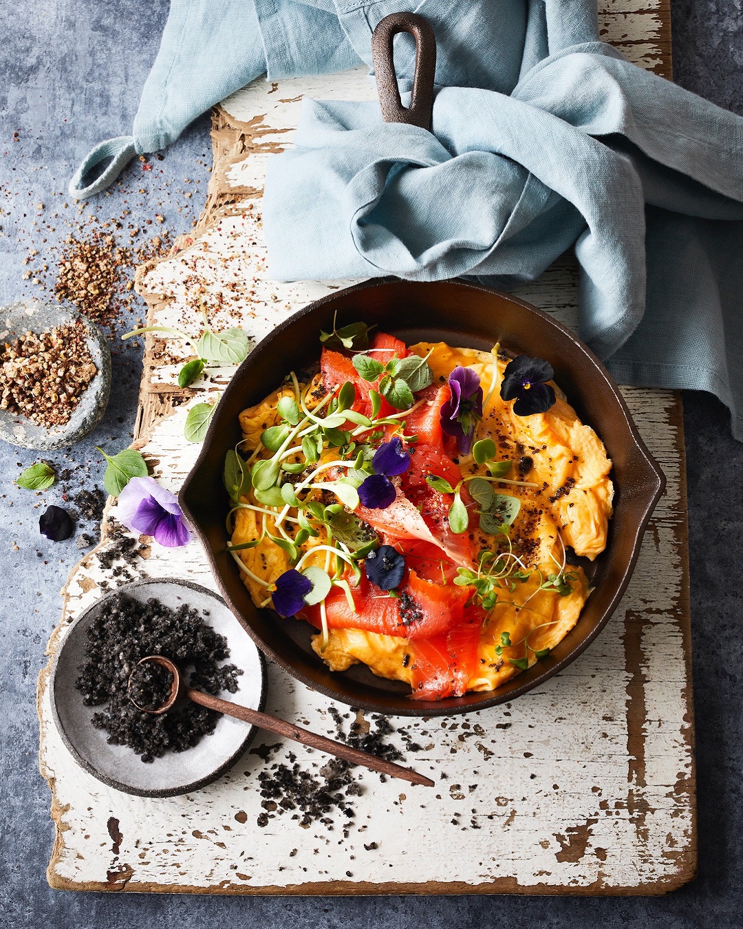 Curry dish on board with salt in a bowl