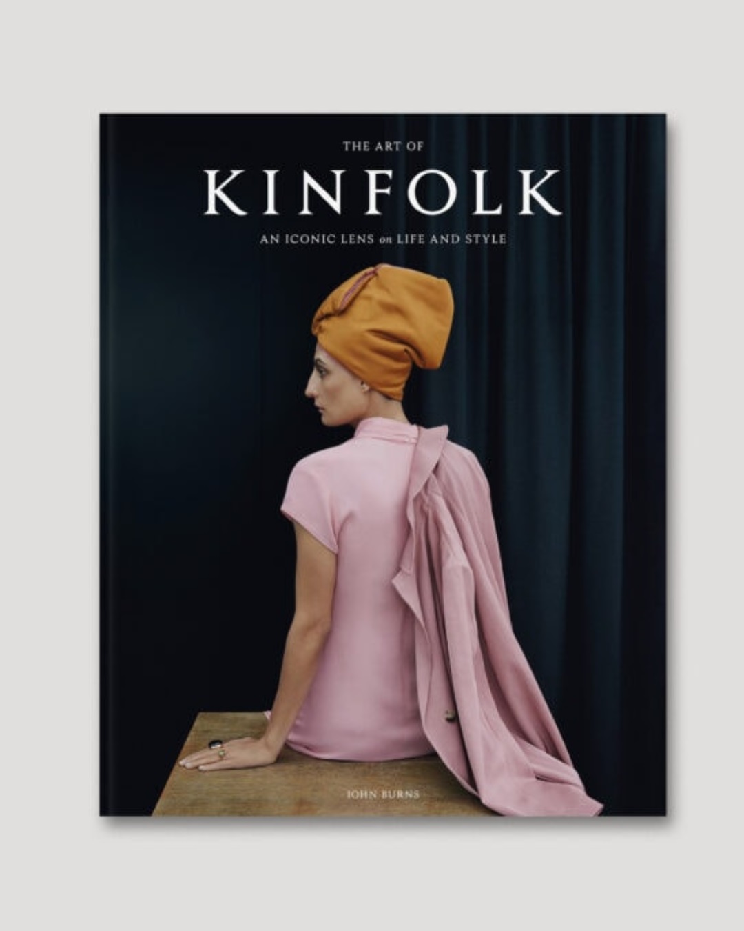 The art of kinfolk book with woman in pink and orange on cover