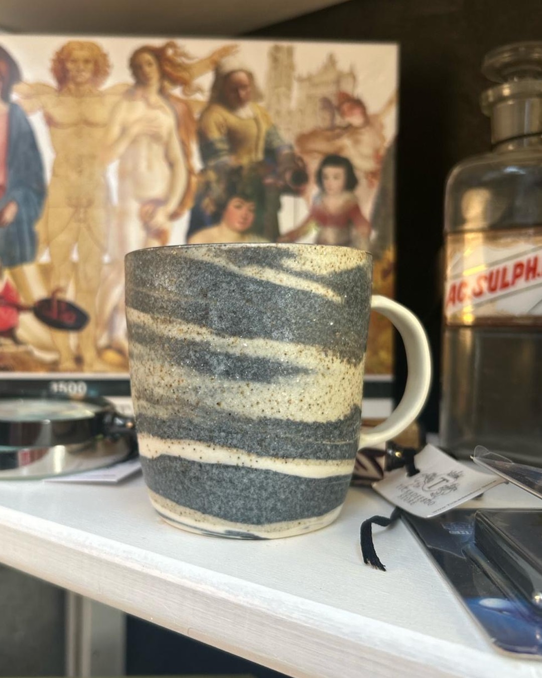 Thrown natural mug on shelf