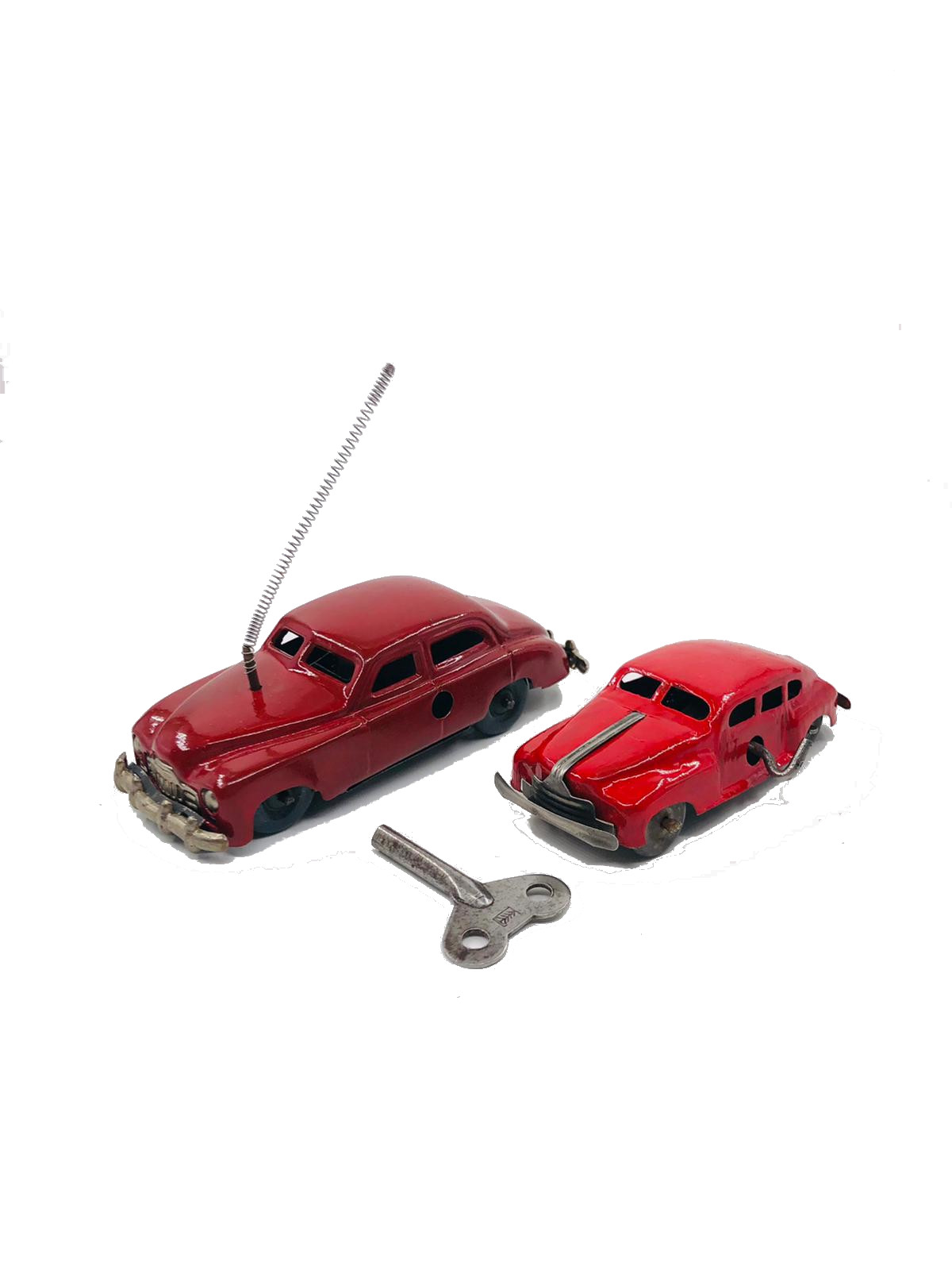 Tin wind up red collectable cars