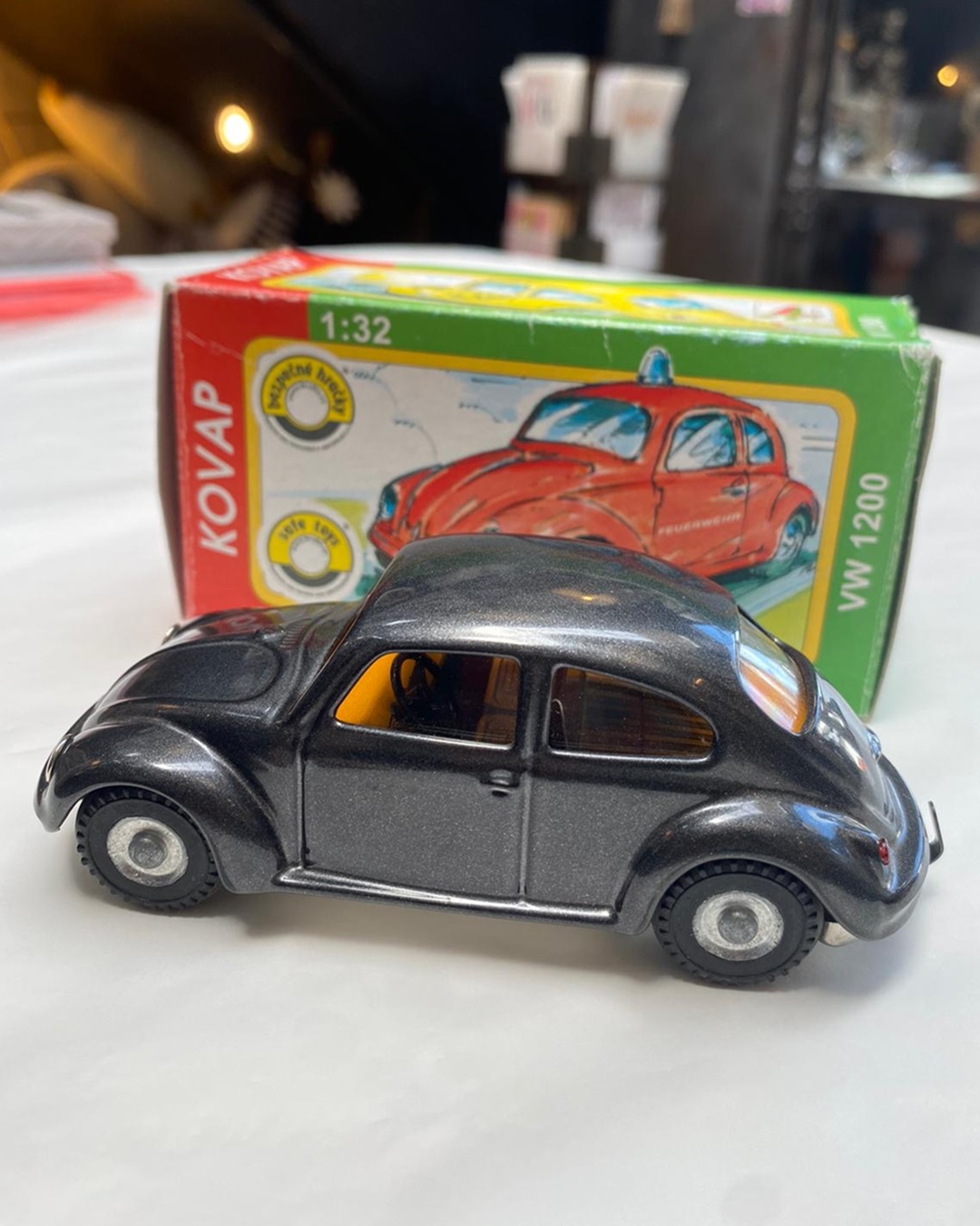 Black VW toy car with box
