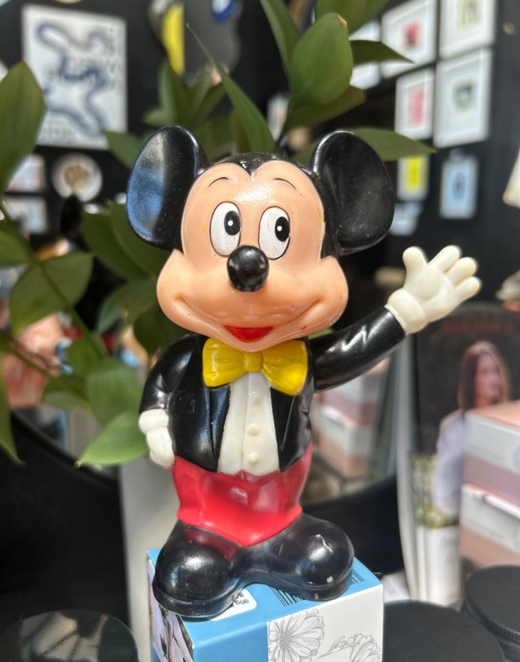 Mickey mouse money box on shelf