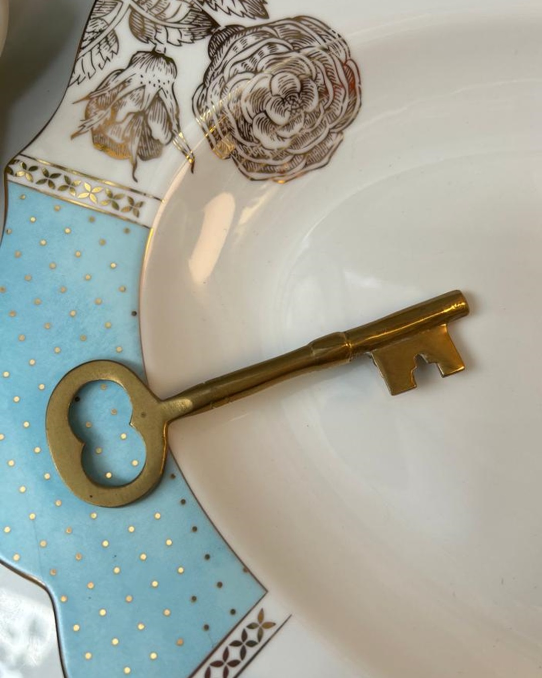 Brass key on plate