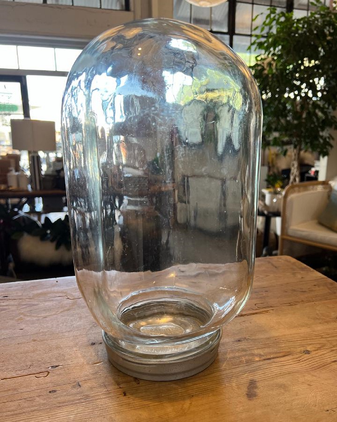 Vintage glass jar upside down on table