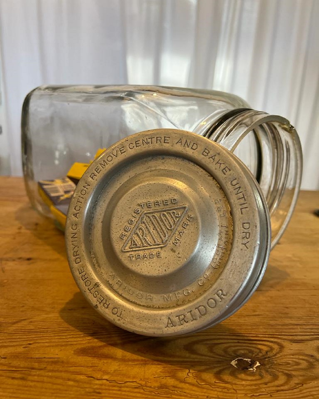 Vintage glass jar with lid and lollies inside