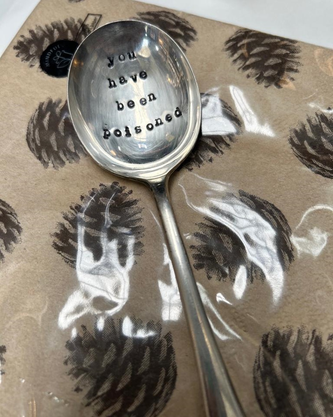 Silver stamped spoon you have been poisoned