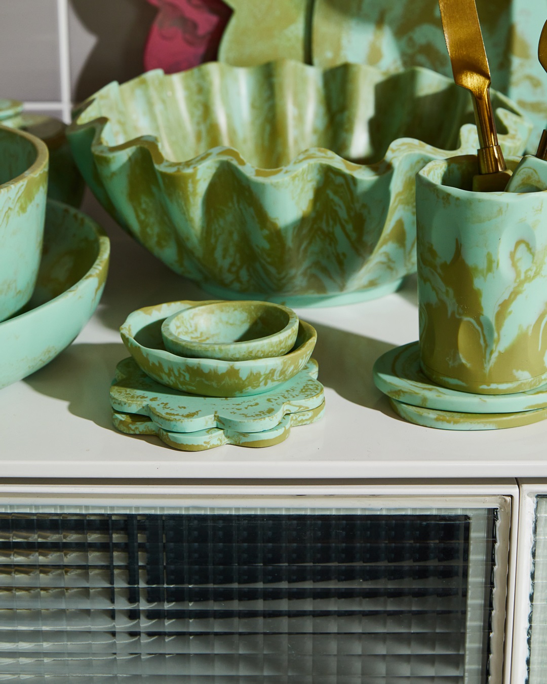 Artichoke green bowls and items on table